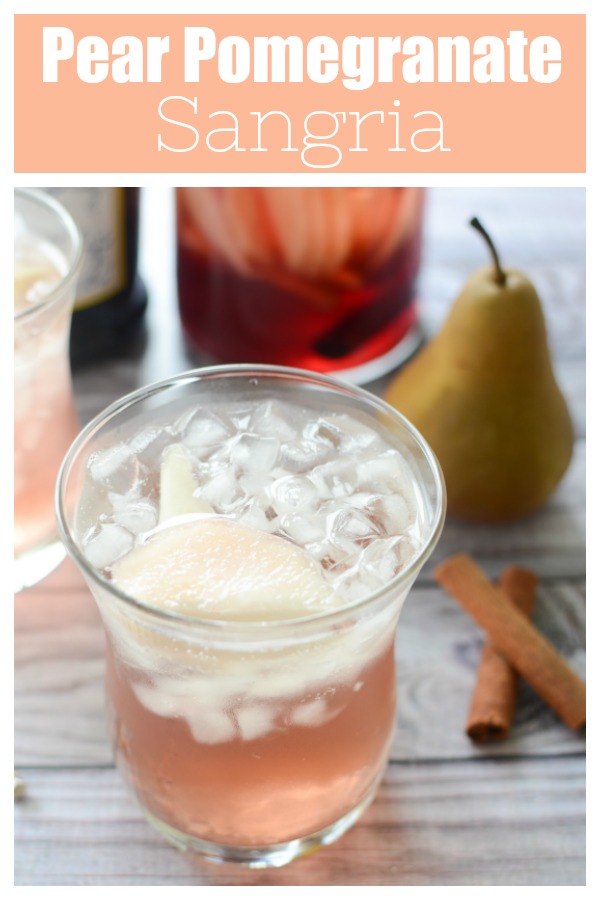 Pear Pomegranate Sangria - delicious white wine sangria with pomegranate juice, brandy, sliced pears, cinnamon, and topped with Prosecco. How delicious would this be for the holidays?